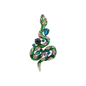 Macro detail of snake brooch featuring green enamel and multicolored crystal inlay