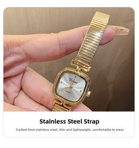 Detail of square gold steel watch with silver sunray dial and crystal hour markers