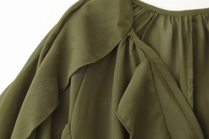 Detailed macro view of military green chiffon shirt collar with layered ruffle stitching