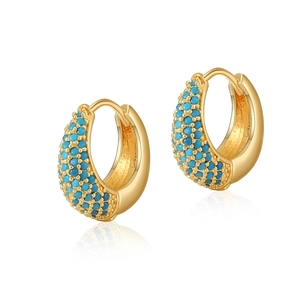 Detail of gold hoop earrings featuring inlaid blue turquoise beads on a white background