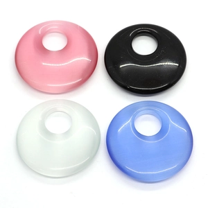 Polished natural cat eye stone round pendants in pink, black, white, and blue colors