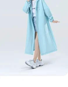 Close-up of light blue raincoat made of thick Oxford cloth with snap button closure