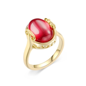 Vintage gold plated steel ring with large oval red chalcedony and floral carvings