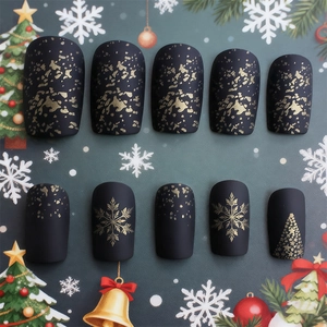 Matte black Christmas press-on nails with golden snowflake and tree patterns