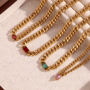 Close-up of 18K gold plated Cuban chain necklace with colorful zircon gemstones