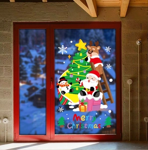 Detail view of Merry Christmas window decals with Santa Claus and reindeer on glass door