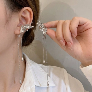 Silver butterfly wing ear cuffs with long tassel chains and metallic teardrop pendants