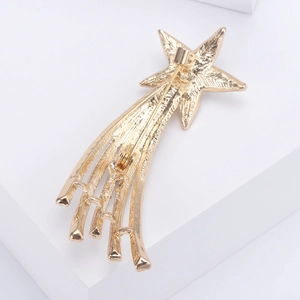 Back view of gold comet star brooch with tassel rhinestones showing pin clasp mechanism