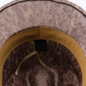 Detail of vintage cowboy hat interior showing the polyester label and sweatband