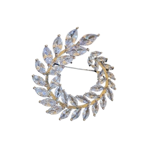 Elegant gold leaf brooch featuring sparkling marquise-cut cubic zirconia in a wheat design