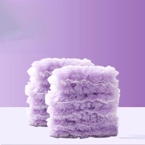 Pair of lavender purple plush wristbands with soft faux fur texture for skin care