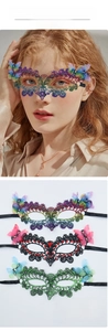 Detail of glitter lace butterfly masks with rhinestones for Halloween party costumes