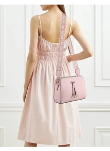 Pink PU leather crossbody bag with wide geometric pattern strap and tassel detail