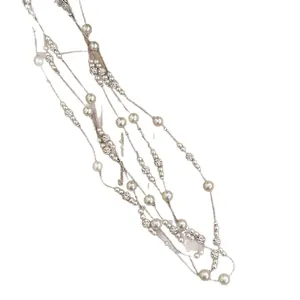 Elegant multi-strand pearl necklace with rhinestone flower charms in retro French style