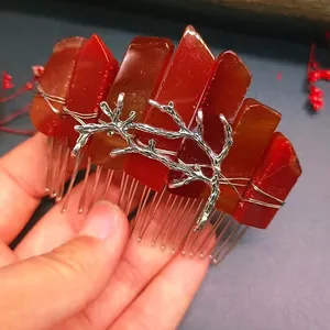 Handmade red crystal hair comb with silver leaf metal decor in a vintage forest style