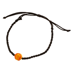 Detail of adjustable black woven bracelet featuring a yellow tennis ball charm and texture