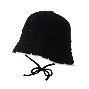 Girls' black knit bucket hat with white trim and chin straps for autumn and winter