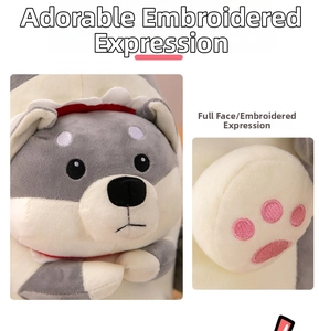 Close-up of cute embroidered facial expressions and paw details on the shark dog plush toy