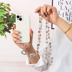 Close-up of white wavy phone case with multicolor crystal beaded crossbody strap