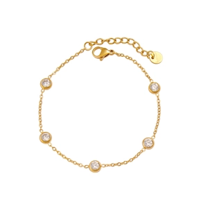 Detailed macro view of gold-plated stainless steel chain bracelet with six inset crystals