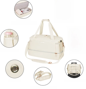 Detailed view of beige fitness bag features like USB port, shoe compartment and trolley strap