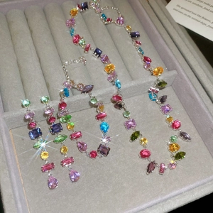 Colorful zircon jewelry set with square stones in a grey velvet gift box showcase
