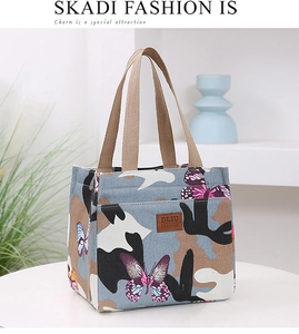 Détail du sac à déjeuner DLIU FASHION avec motifs papillons et poignées tissées