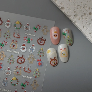 Detailed view of 5D embossed Christmas nail stickers with Santa and reindeer patterns