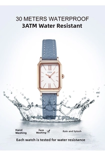 Detail view of square waterproof watch with water splash and leather strap effect