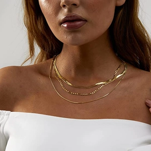 Three-layer layered gold stainless steel necklace featuring snake, figaro and round chains