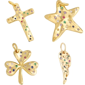 Gold pendants in cross, starfish, clover, and wing shapes with multicolor zircons