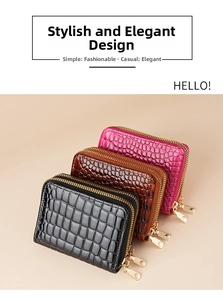 Detail of multi-slot card holders in crocodile texture patent leather with double zippers