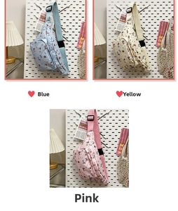 Detailed view of cartoon crossbody bags in blue yellow and pink waterproof canvas