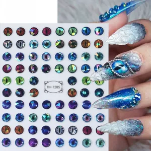 Macro detail of 3D dragon eye nail stickers with metallic textures and butterfly patterns