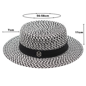 Detail of woven boater hat featuring M logo and size 56-58cm, 7cm brim, 11cm height