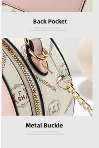 Detail of pink and beige leather bag showing the back pocket and gold chain buckle