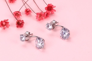 Close-up of S925 silver stamp and double zirconia crystal settings on earrings