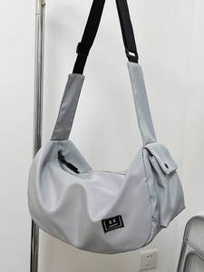 Grey large capacity nylon gym bag with adjustable shoulder strap and utility pockets
