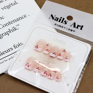 French cherry print press-on nails in pink translucent finish with white tips size XS