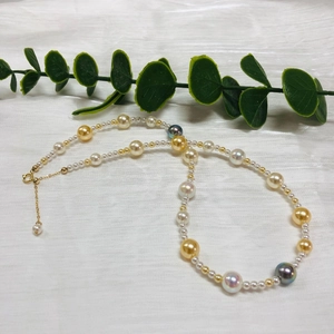 Multicolor 925 silver Akoya style pearl necklace with adjustable golden clasp on white background