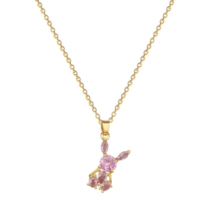 Pink crystal rabbit pendant necklace with gold titanium steel chain on white background