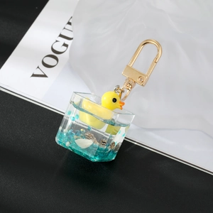 Creative yellow duck liquid keychain with blue glitter in transparent acrylic box