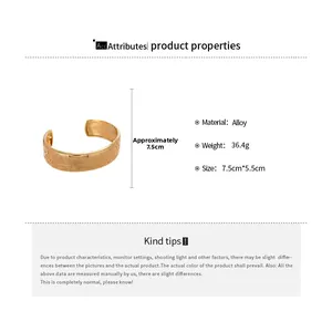 Detailed view of gold oval cuff bracelet with vintage relief texture and alloy material