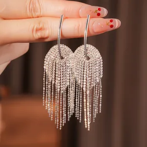 Elegant silver tassel earrings with sparkling rhinestones in a refined double-arch design