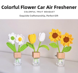 Detail of handmade crochet sunflower and tulip car aromatherapy diffuser with wood lid