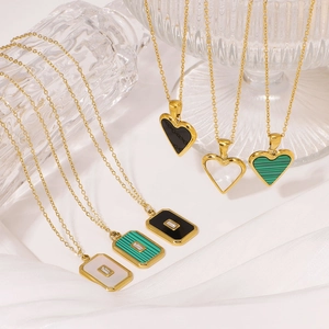 Gold plated necklaces with heart and square natural stone pendants on white silk