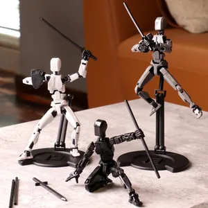 Articulated 3D printed action figures with weapons and circular stands on stone surface