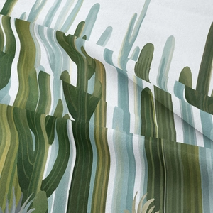 Close-up of woven cactus pattern tapestry fabric showing texture and green tones