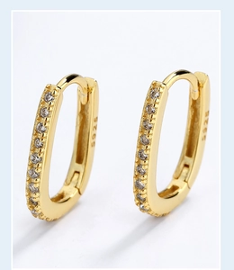 Close-up of S925 hallmark on gold plated geometric hoop earring with pavé zircon stones
