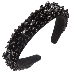 Detail of wide black fabric headband with irregular pearls and shiny faceted crystals